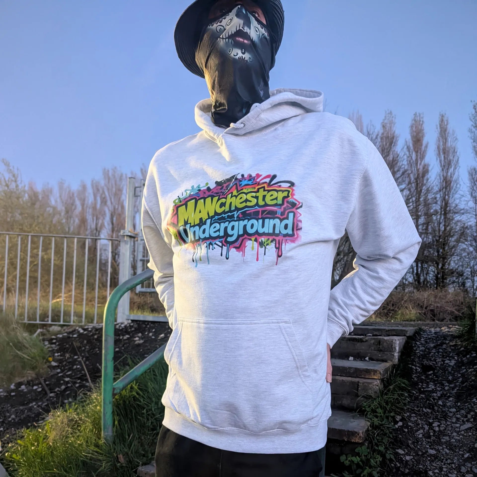 The Spirit Walker wearing Manchester Underground Ash Hoodie ash Manchester street location