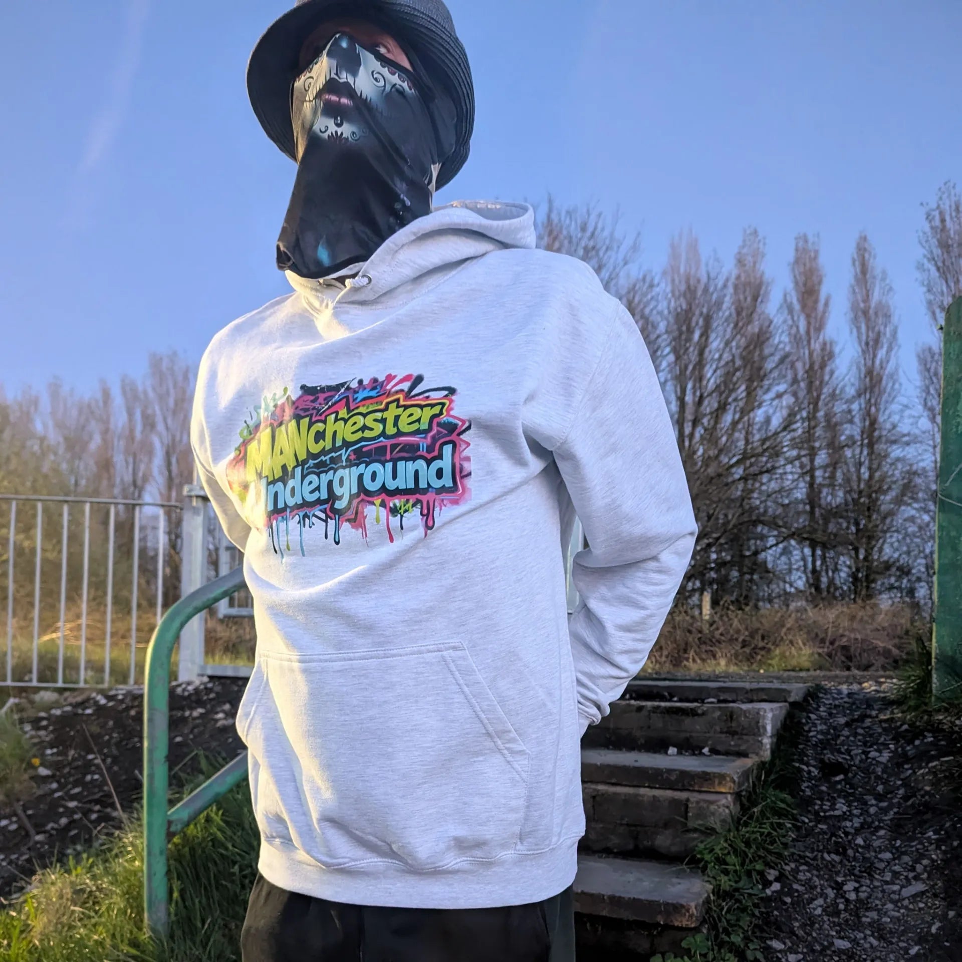 The Spirit Walker wearing Manchester Underground Ash Hoodie ash Manchester street location