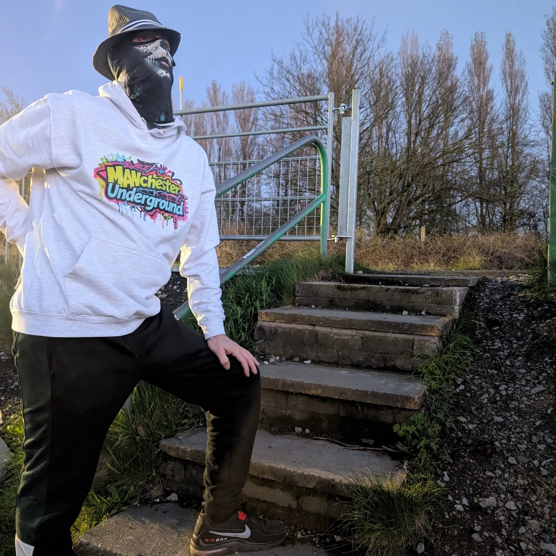 The Spirit Walker wearing Manchester Underground Ash Hoodie ash Manchester street location