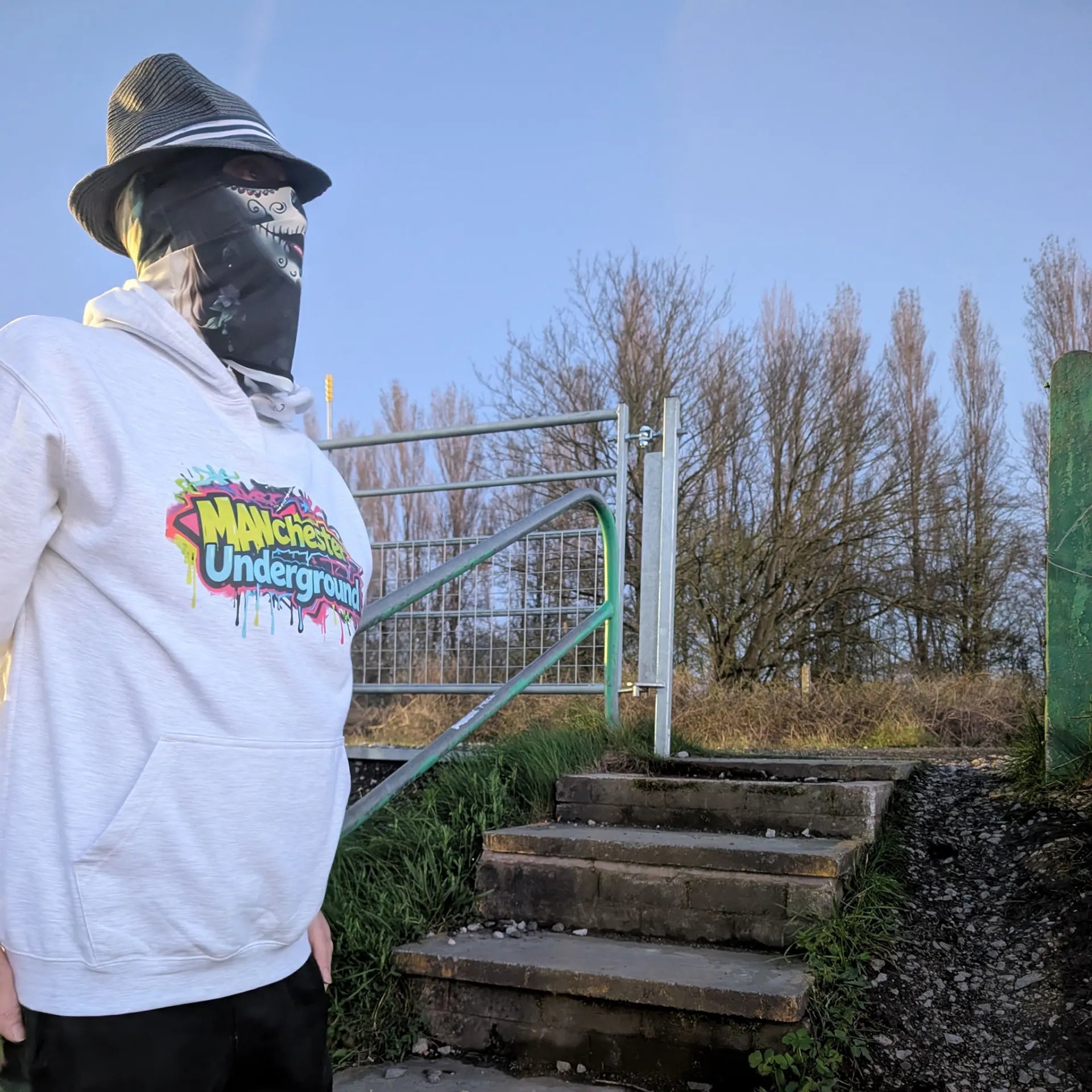 The Spirit Walker wearing Manchester Underground Ash Hoodie ash Manchester street location