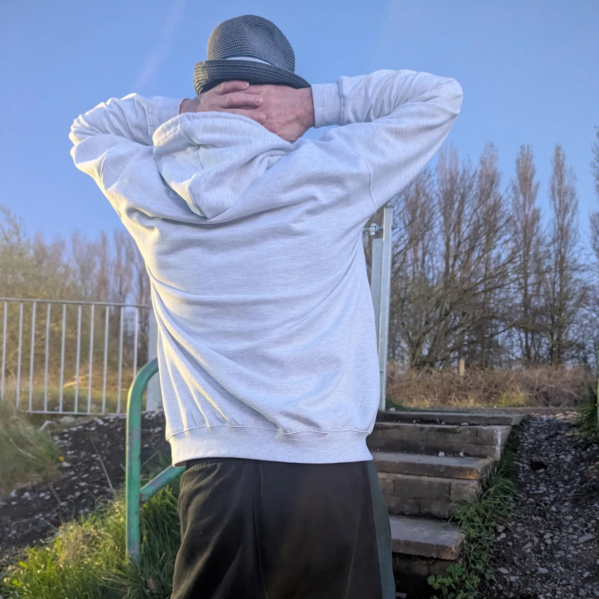 The Spirit Walker wearing Manchester Underground Ash Hoodie ash Manchester street location