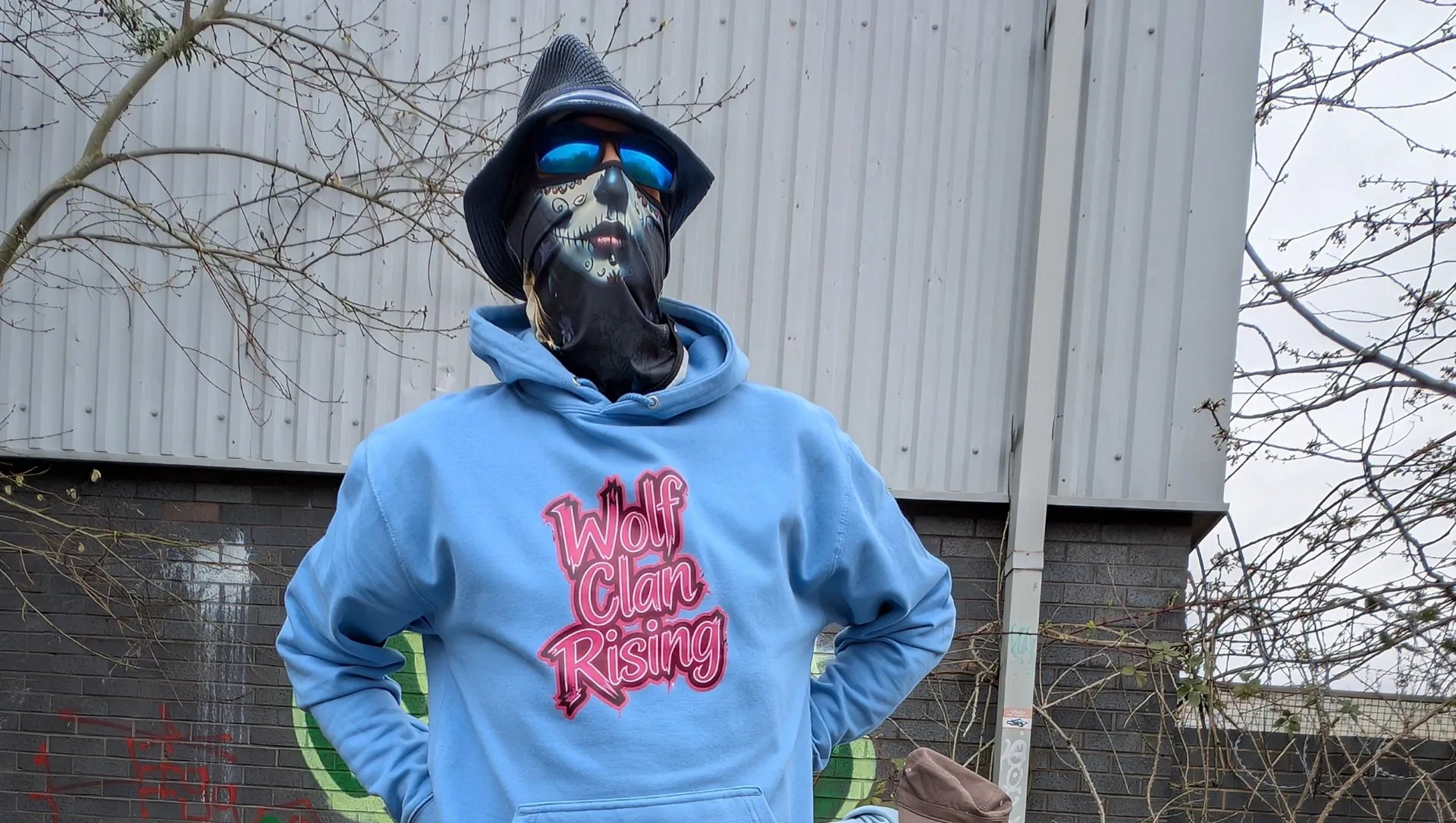 The Sun Walker wearing Wolf Clan Rising Fashion Hoodie Manchester graffiti location